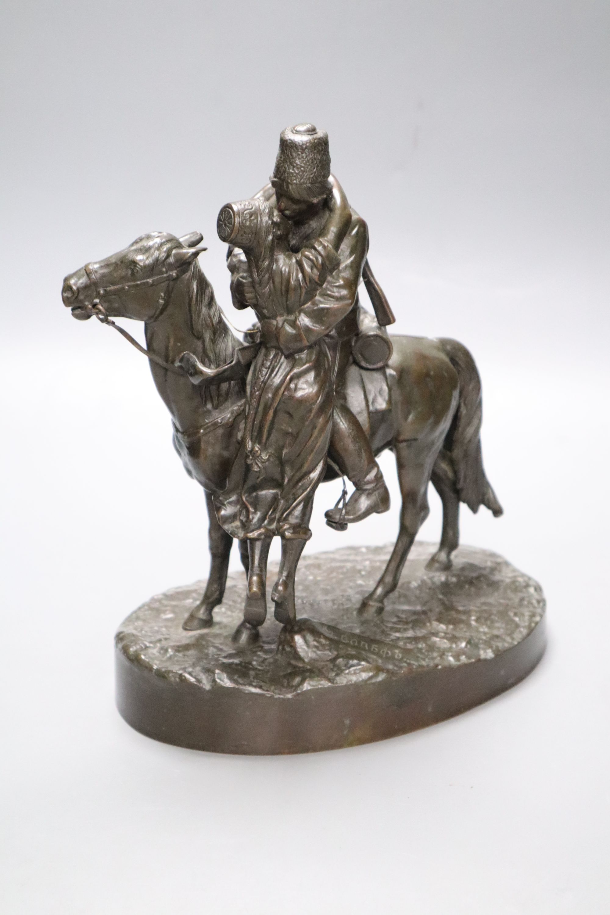 A Russian bronze of a gentleman on horseback kissing his lover, signed, height 25cm